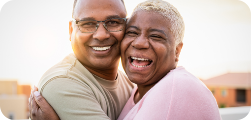 Two people embracing and laughing